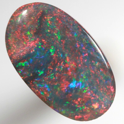 SOLID BLACK OPAL Gemmy red, very bright and rich SEE VIDEO
